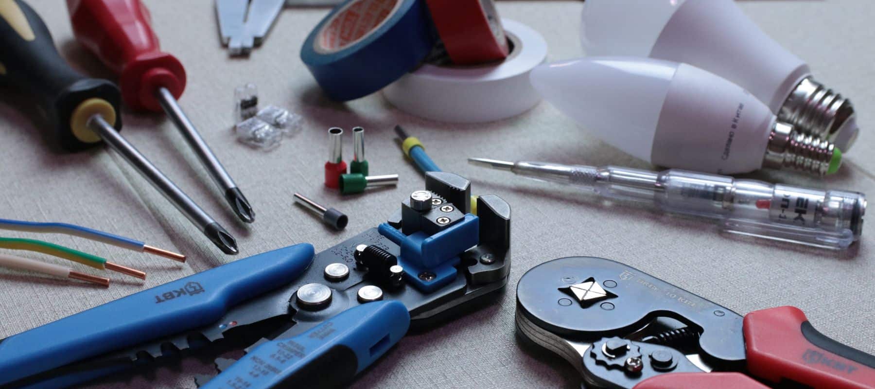 electrical repair tools laid out on a table