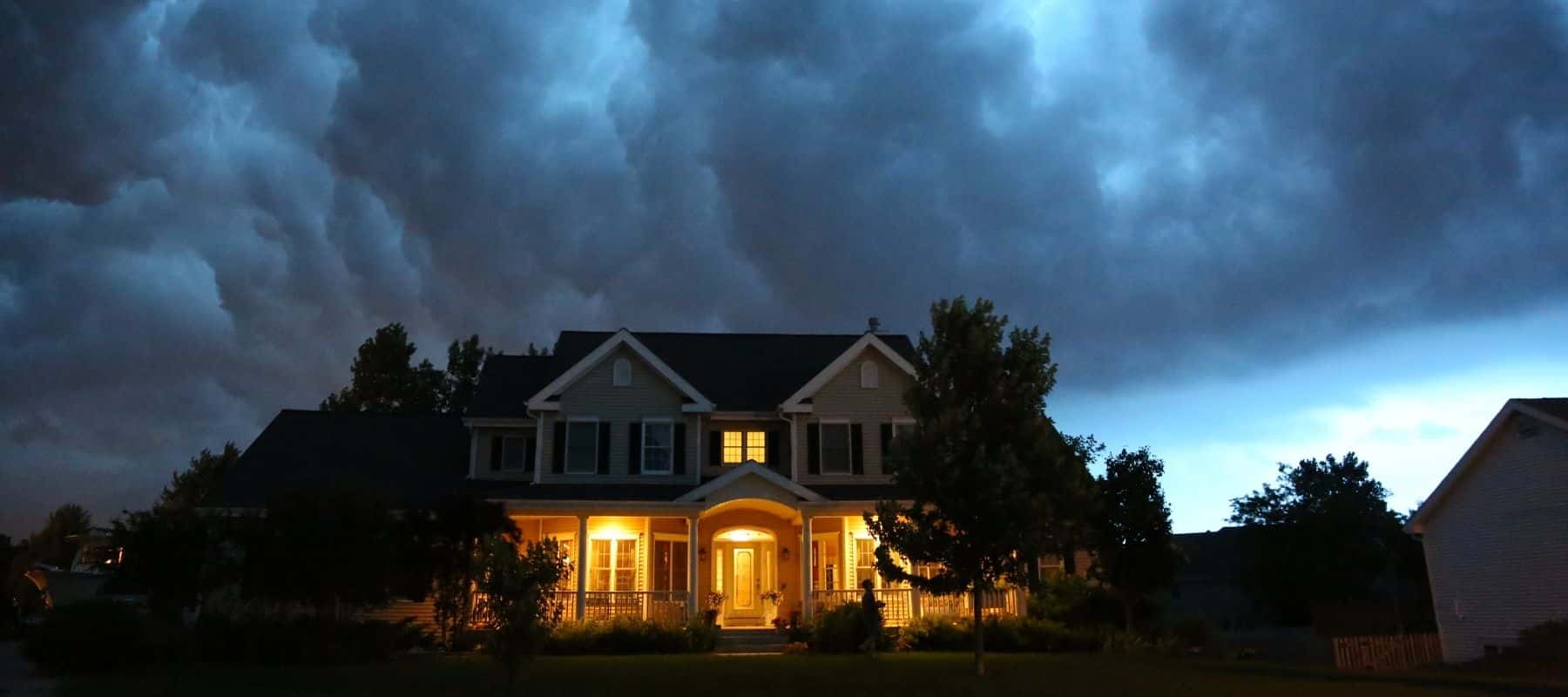 nice house under dark clouds